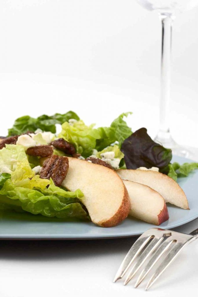 Salad with a handful of pecans