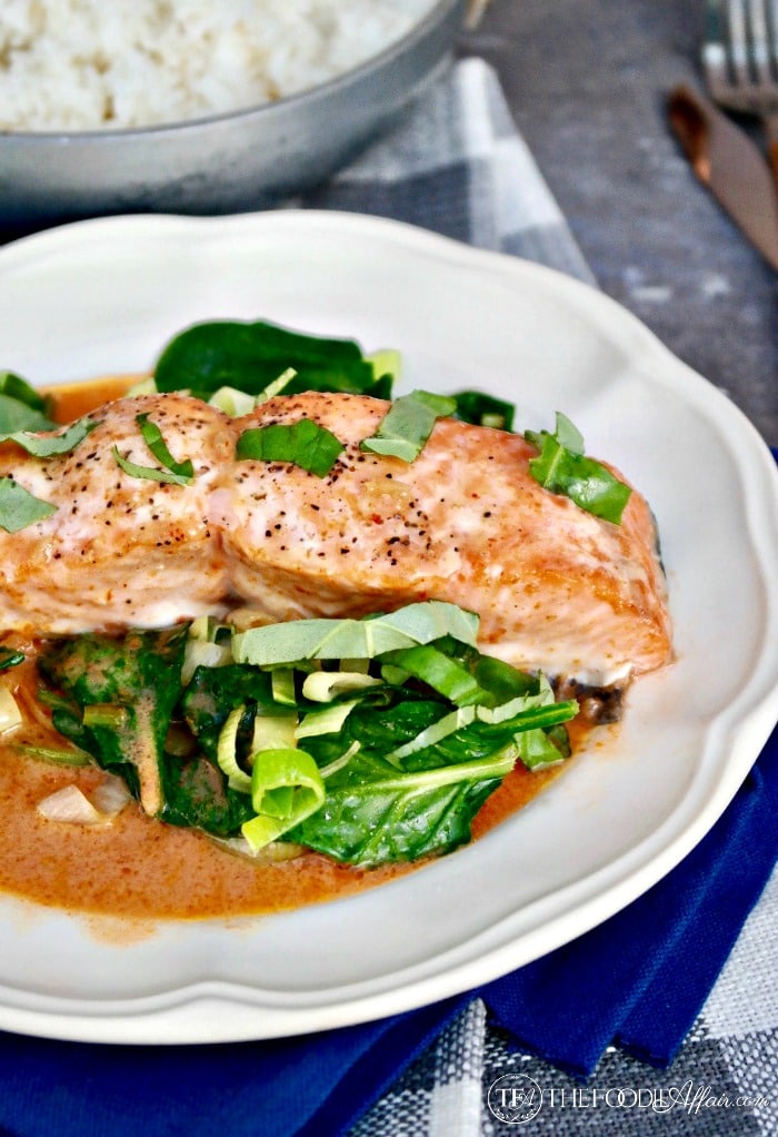 SALMON COCONUT RED CURRY SAUCE OVER SAUTÉED SPINACH